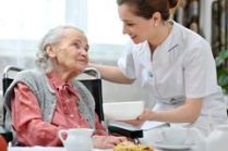 senior-woman-home-caregiver-women-eats-lunch-retirement-36610644